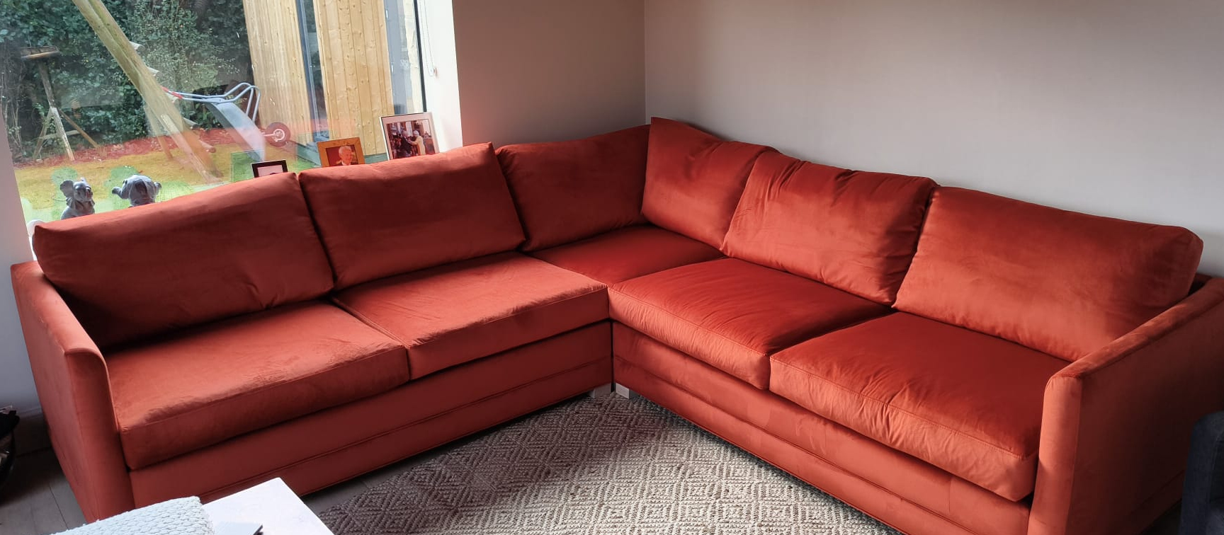 Handmade Craft corner sofa in burnt orange velvet in a real Scottish living room